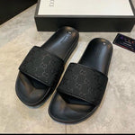 Tonal Monogram Embossed Slide Sandals – Black – Black product view